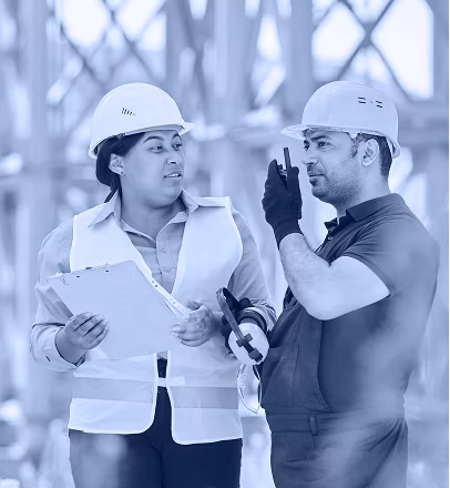 Two people with hard hats on